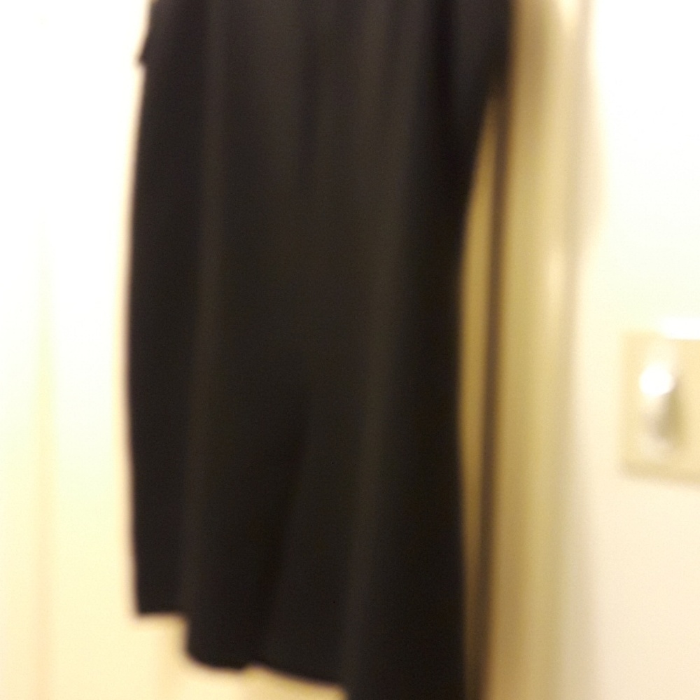 Black skirt with split in the back .